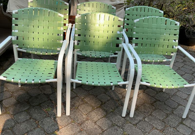 6 White Metal & Green Vinyl Patio Chairs - Image 1 of 5