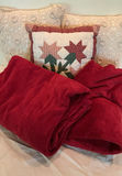 Decorative pillows with crocheted lace covers and red throw blanket - thumbnail 1 of 5