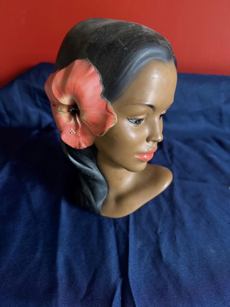 Hibiscus-ornamented female bust sculpture - image 1 of 4