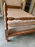 Wooden bed frame with turned posts and mattress - thumbnail 1 of 4