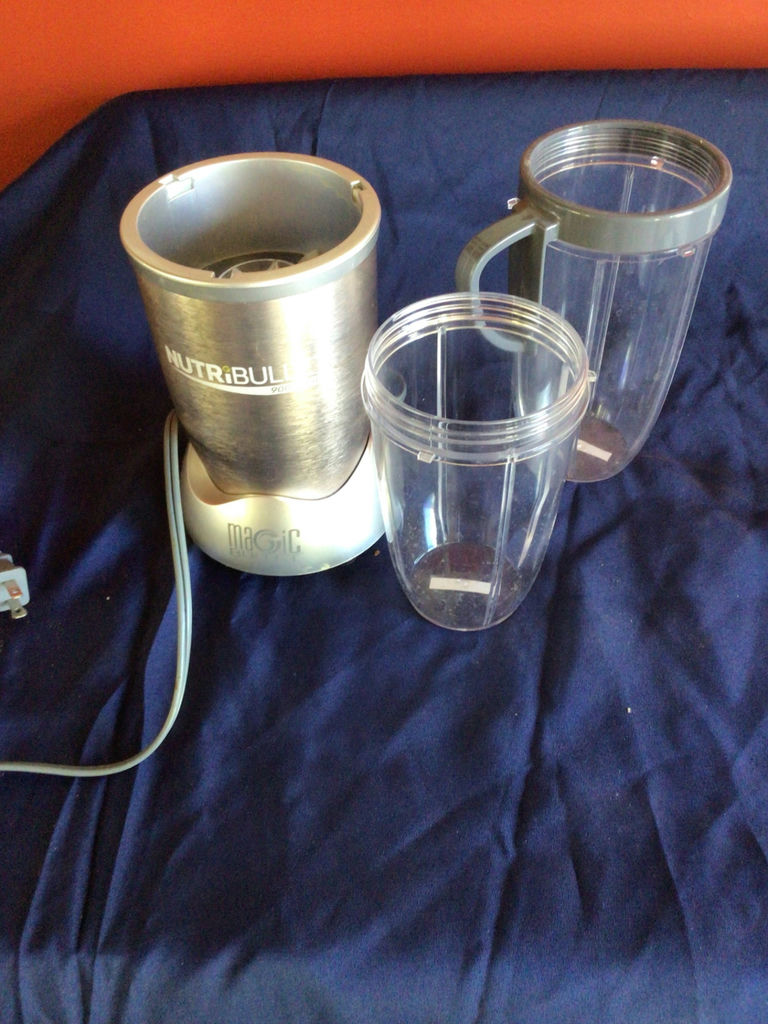 NutriBullet blender with cups and lids - image 1 of 2