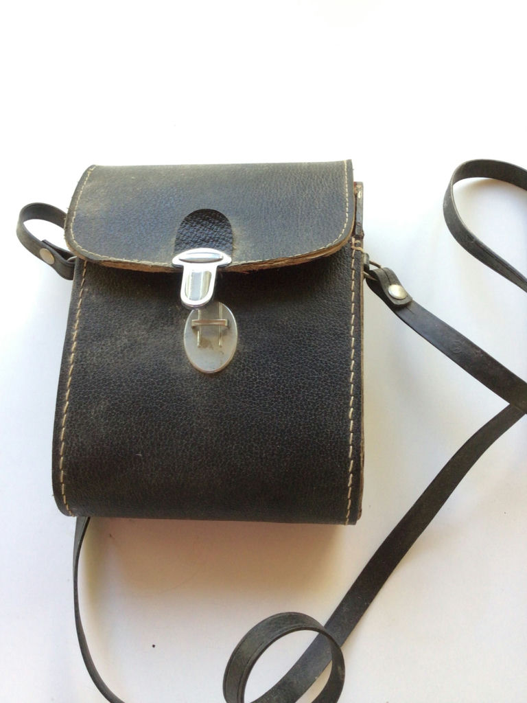 Leather carrying case with compact binoculars - image 1 of 3