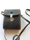 Leather carrying case with compact binoculars - thumbnail 1 of 3