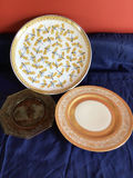 Dragonfly-pattern plate, ornate-border plate, and brown glass dish - thumbnail 1 of 4