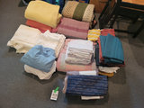Collection of Folded Blankets and Linens - thumbnail 1 of 2