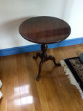 Round dark wood pedestal table - thumbnail 1 of 3