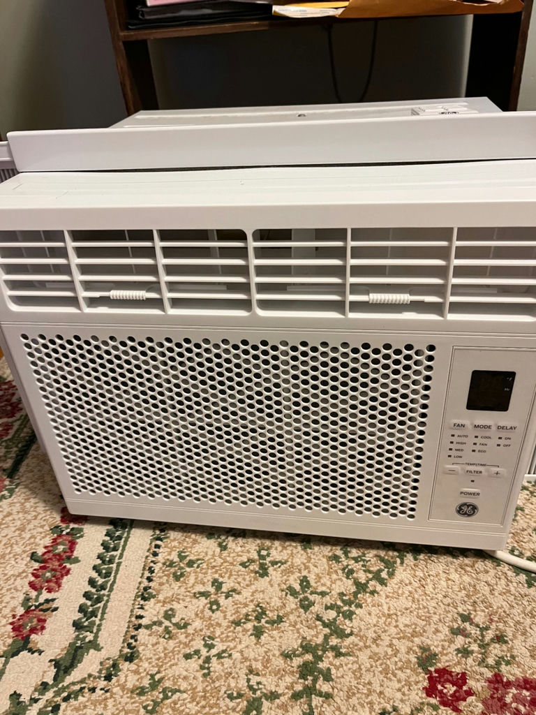 White GE window air conditioner with remote - image 1 of 3