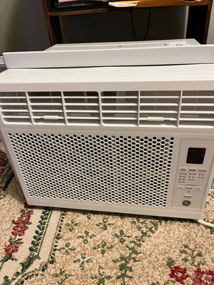 White GE window air conditioner with remote - Image 1 of 3