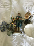 Decorative ceramic figurine, planters, blue-and-white dishware, and a reed diffuser - thumbnail 1 of 3