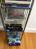 CD rack with stacked music CDs - thumbnail 5 of 5