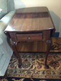 Dark wood end table with single drawer and curved legs - thumbnail 1 of 3