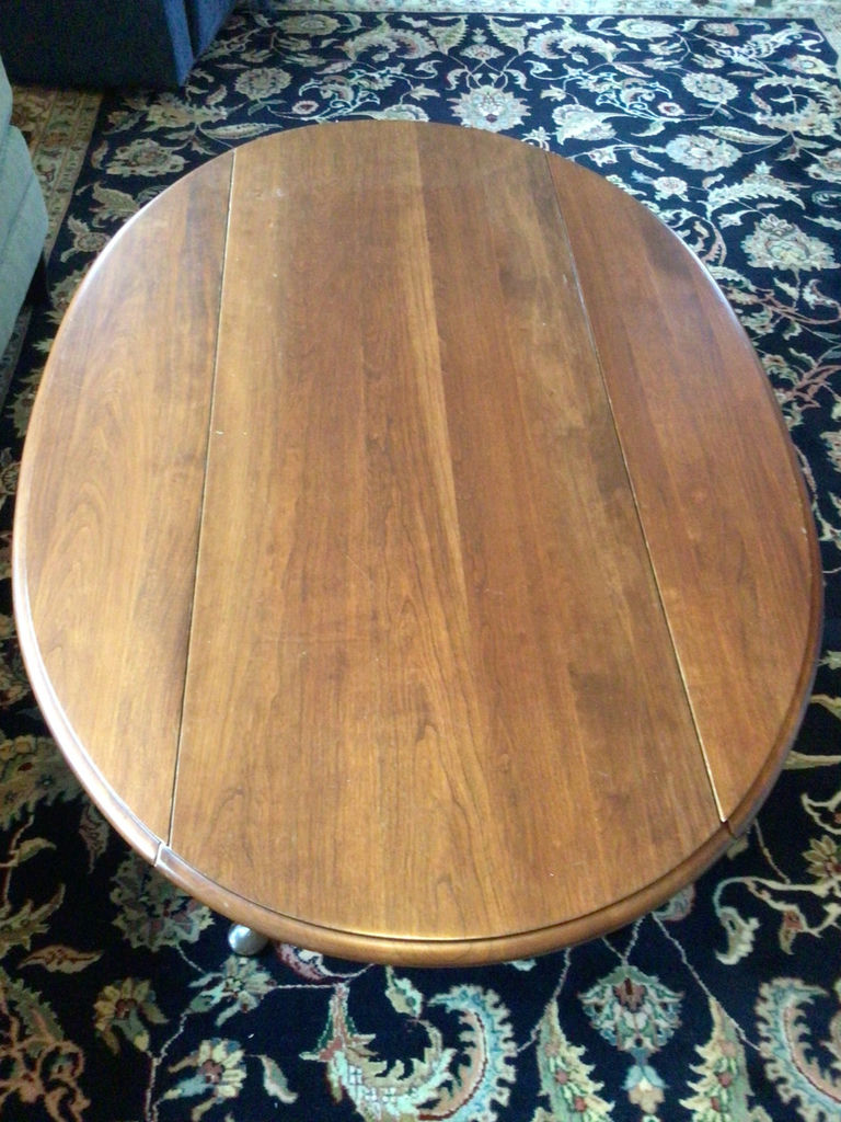 Oval wooden coffee table with drop-leaf ends - image 3 of 4