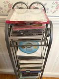 CD rack with stacked music CDs - thumbnail 2 of 5
