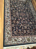Oriental rug with black floral center and decorative border - thumbnail 2 of 4
