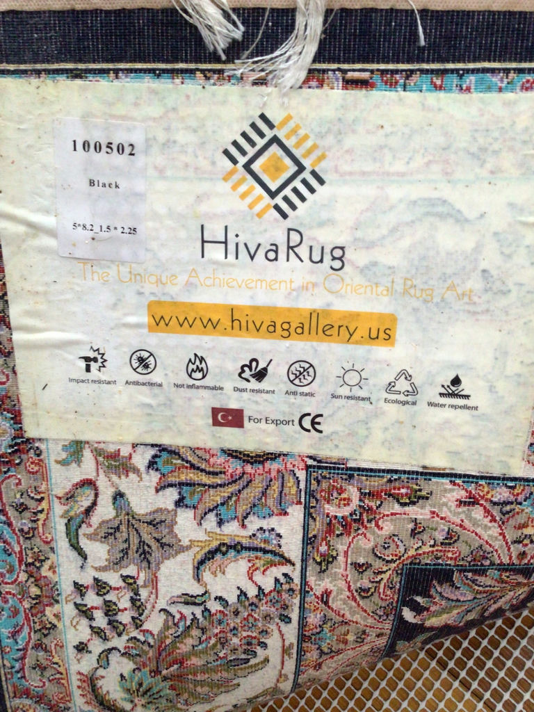 Oriental rug with black floral center and decorative border - image 4 of 4