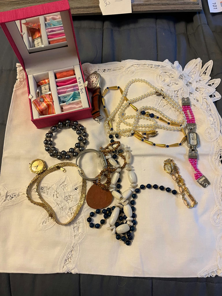 Jewelry assortment with necklaces, bracelets, and watch - image 1 of 1