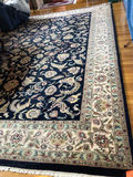 Black and Navy Blue Oriental Area Rug with Floral Border - thumbnail 1 of 3