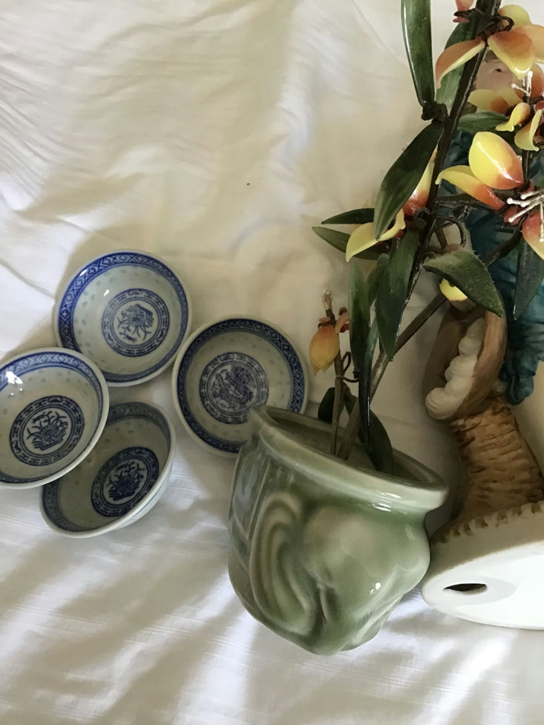 Decorative ceramic figurine, planters, blue-and-white dishware, and a reed diffuser - image 2 of 3