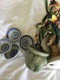 Decorative ceramic figurine, planters, blue-and-white dishware, and a reed diffuser - thumbnail 2 of 3