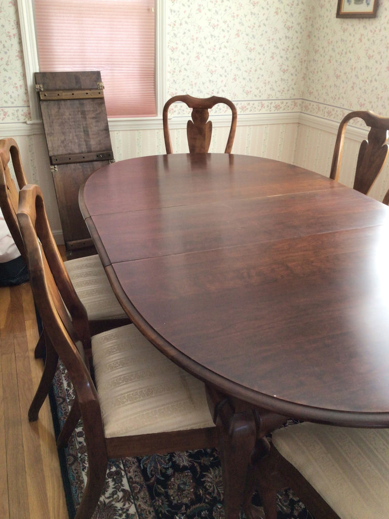 Oval dining table with six carved wooden chairs - image 1 of 4