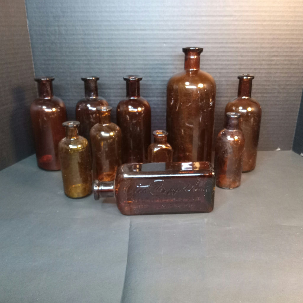 Antique Amber Glass Bottles - image 1 of 15