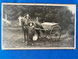 A Boy Delivering Milk Walking Alongside a Horse and Cart Photo - thumbnail 1 of 3