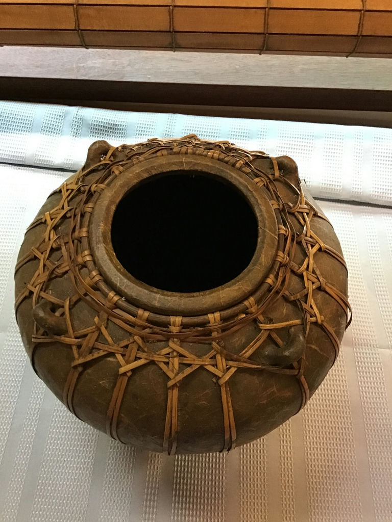 Round ceramic pot wrapped in woven rattan - image 2 of 4