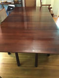 Dark wood dining table with extension leaves 45x44 w/o leaves. 3 leaves total 41 1/2 . Size w leaves 86 1/2 x 44 - thumbnail 1 of 4