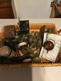 Assorted vintage door knobs and hardware in a basket - thumbnail 1 of 1