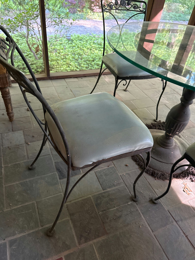 Round glass dining table with four cushioned metal chairs - image 4 of 4