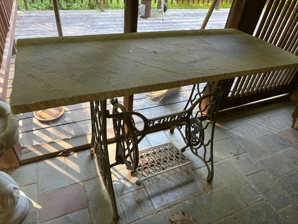 Vintage Singer treadle sewing machine table with stone top - image 1 of 3