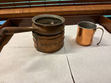 Group of vintage copper kitchenware: pot with wooden handle, mug, and perforated insert - thumbnail 1 of 5