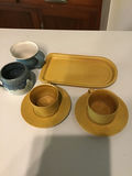 Yellow ceramic cup and saucer set with tray and blue mugs - thumbnail 1 of 2