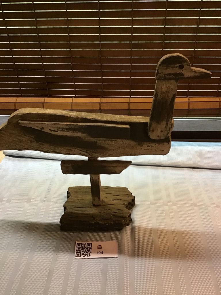 Rustic wooden duck sculpture on a stand - image 1 of 3