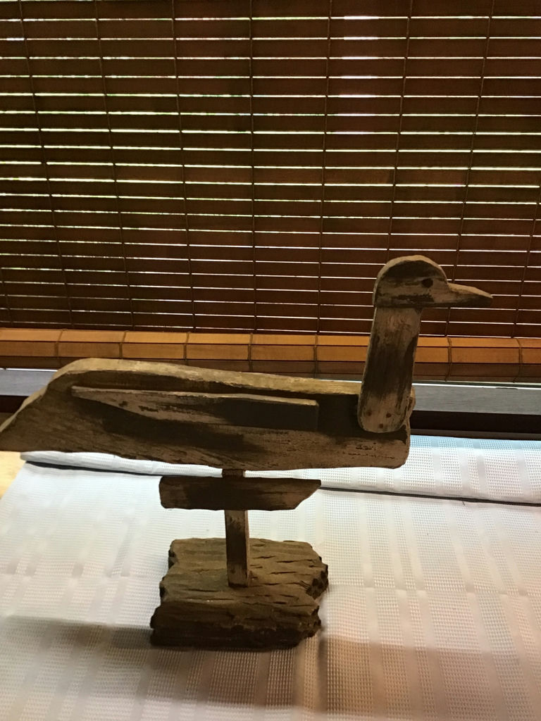 Rustic wooden duck sculpture on a stand - image 2 of 3