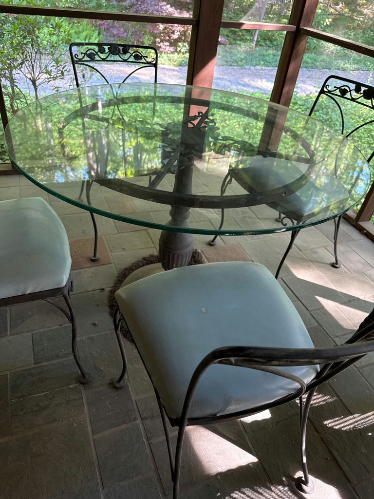 Round glass dining table with four cushioned metal chairs - image 2 of 4