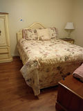 Full Size Bed with Headboard and Floral Bedding - thumbnail 1 of 3