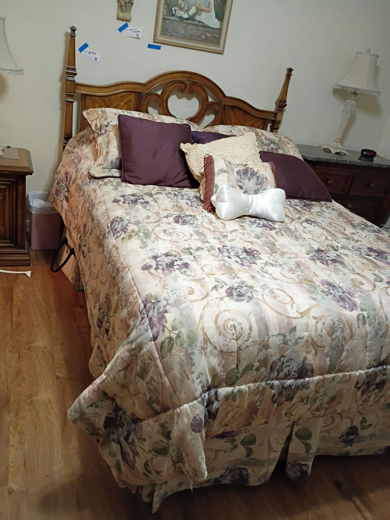 Wooden Bed Frame with Floral Bedding - image 2 of 4