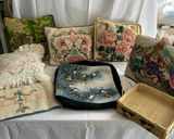Needlepoint cushions, a woven basket, and a tapestry-top stool - thumbnail 1 of 7