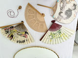 Oval gilt-mild mirror with vintage perfume bottles and decorative folding fans - thumbnail 5 of 5