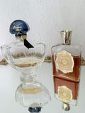Oval gilt-mild mirror with vintage perfume bottles and decorative folding fans - thumbnail 4 of 5