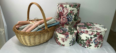 Wicker Basket with Fabric-Covered Hangers and Floral Round Boxes - Image 1 of 3