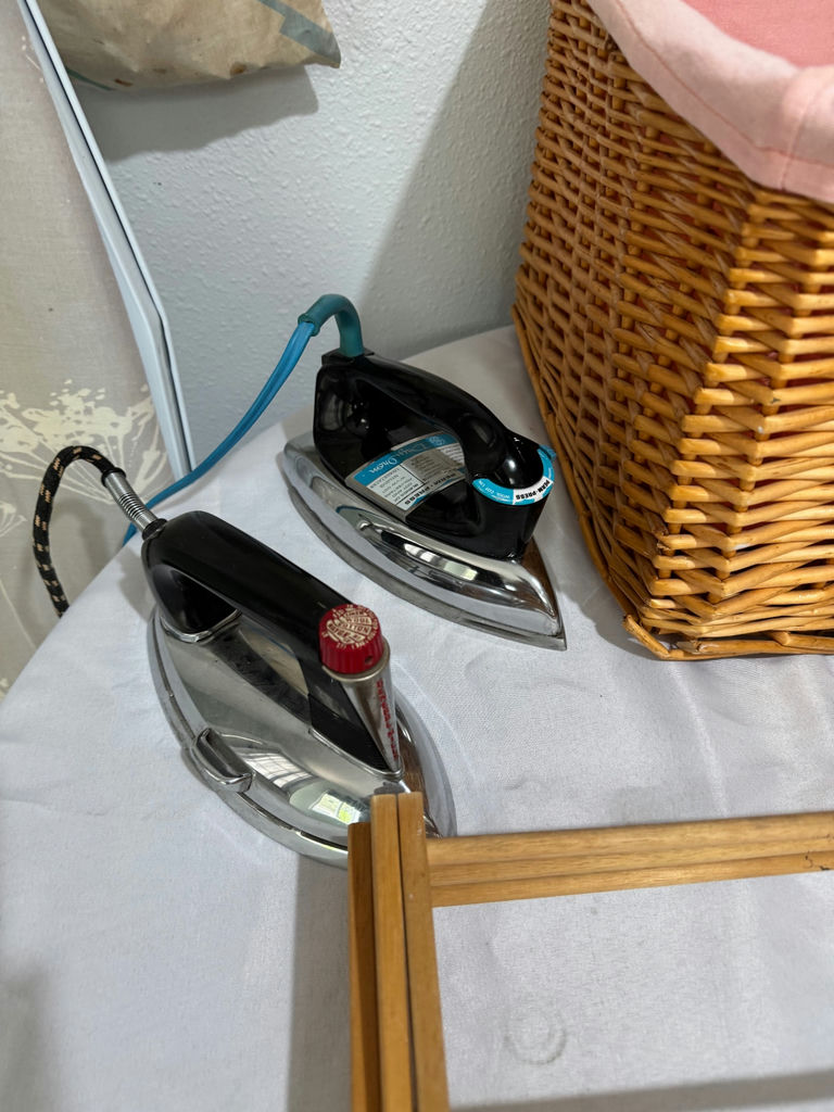 Ironing board with irons, wicker laundry basket, garment bag, and drying rack components - image 2 of 7