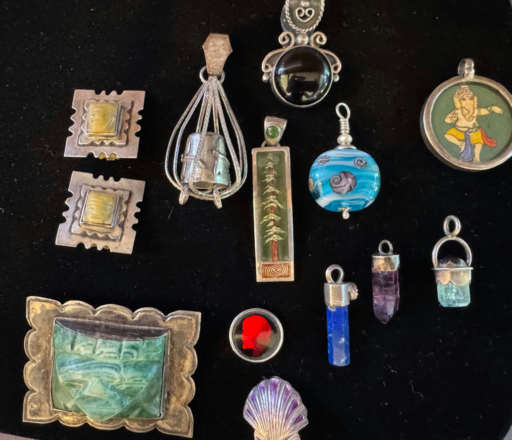 Assorted jewelry collection with pendants and beads - image 1 of 11
