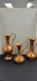 Three Copper Pitchers with Brass Handles - thumbnail 1 of 9