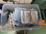 Plastic Storage Bin with Assorted Linens - thumbnail 2 of 3