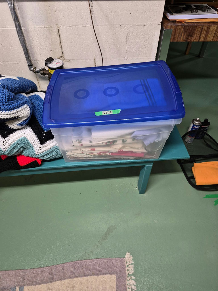 Plastic Storage Bin with Assorted Linens - image 1 of 3
