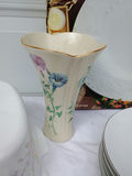 Assorted porcelain dinnerware with floral patterns and serving pieces - thumbnail 9 of 12