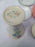 Assorted porcelain dinnerware with floral patterns and serving pieces - thumbnail 10 of 12