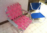 Vintage low webbed pink lawn chair and low canvas chair - thumbnail 1 of 5